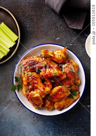 Sweet and spicy chicken wings with glaze 105012619