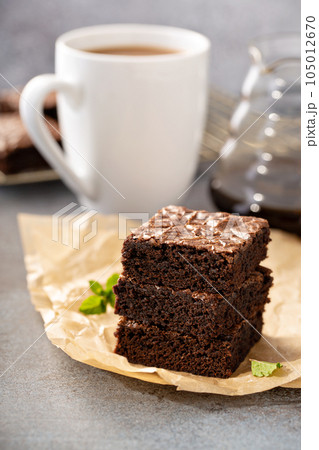 Stack of moist fudgy brownies 105012670
