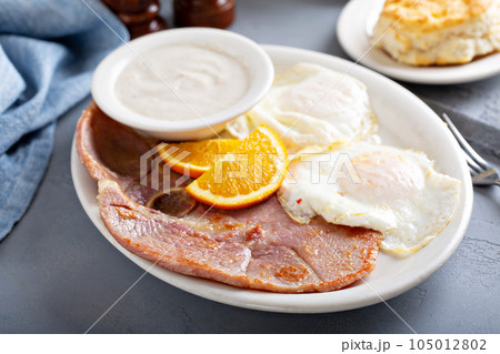 Ham and eggs breakfast with biscuits Ham and eggs breakfast with biscuits 105012802