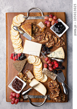 Cheese board with honey and crackers 105013025