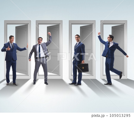 Businessman in uncertainty concept with many doors 105013295