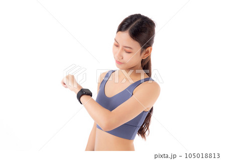 Happy young asian woman looking smartwatch for exercise and aerobics with cardio isolated. Happy young asian woman looking smartwatch for exercise and aerobics with cardio isolated. 105018813