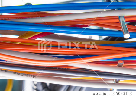Detail of server room with bunch of fiber optic cables 105023110