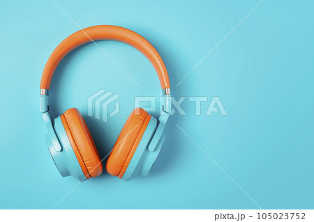 Bright headphones are located on a blue background. Minimalism. Mockup. 105023752