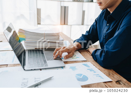 Businessman using computer laptop with planning working on financial document, tax, exchange, accounting and Financial advisor Businessman using computer laptop with planning working on financial document, tax, exchange, accounting and Financial advisor 105024230