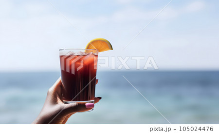african american hand holding glass of cocktail on blurry sea horizon background at sunny day, neural network generated image 105024476