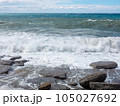 The Mediterranean Sea powerful waves crashing over the rocks in stormy weather. 105027692