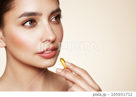 Beautiful Girl With Pill With Cod Liver Oil Omega-3 105031712