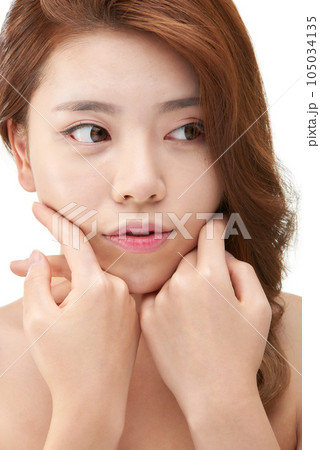 Beauty, a clean-skinned young woman Beauty, a clean-skinned young woman 105034135