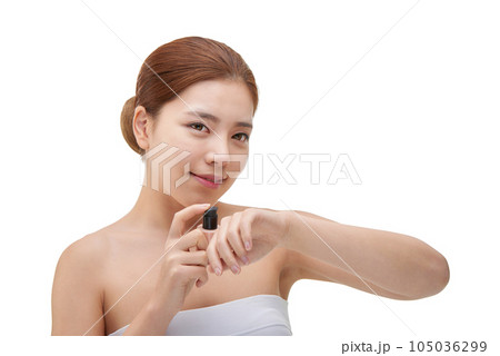 portrait of a young woman taking care of her skin 105036299