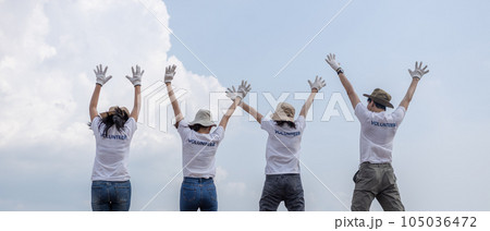 Group of volunteers cheerful success jumping together and arms raised. clean up garbage. 105036472