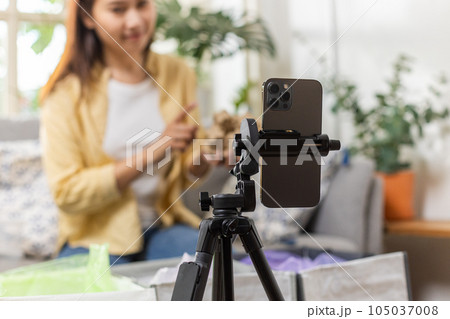 close up smartphone with female live stream talk introducing waste sorting for recycling at home close up smartphone with female live stream talk introducing waste sorting for recycling at home 105037008