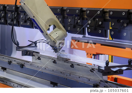Close up the sheet metal bending process by robotic arm. Close up the sheet metal bending process by robotic arm. 105037601