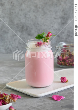 Rose moon milk in mason jar on grey background. 105037631