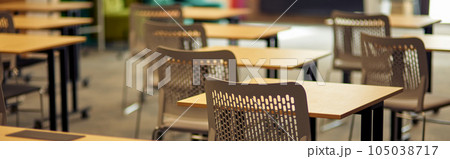 Empty classroom or conference room with desks and chairs Empty classroom or conference room with desks and chairs 105038717