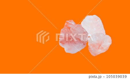 Alum cubes on orange background                               105039039