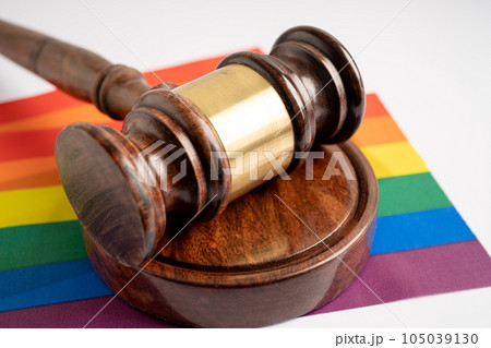 Gavel for judge lawyer on rainbow flag, symbol of LGBT pride month celebrate annual in June social of gay, lesbian, bisexual, transgender, human rights. 105039130