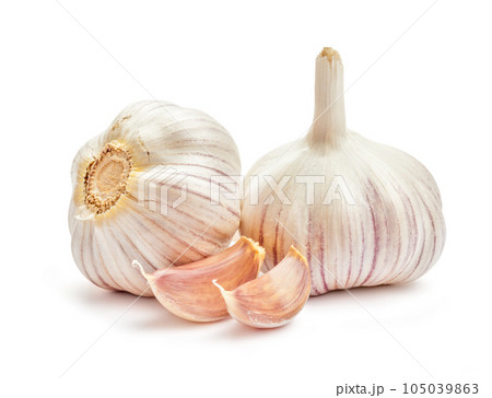 Two garlic bulbs and cloves isolated on white background Two garlic bulbs and cloves isolated on white background 105039863