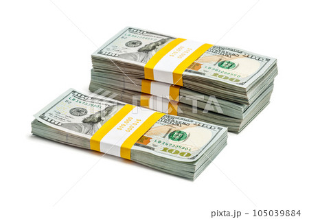Creative business finance making money concept - stack of bundles of 100 US dollars 2013 edition banknotes bills isolated on white 105039884