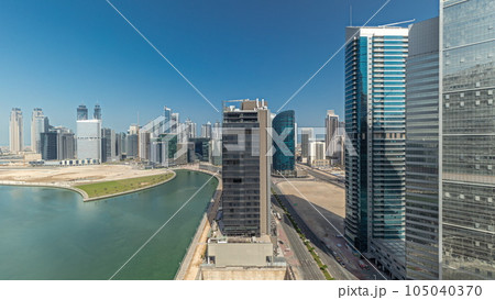 Cityscape skyscrapers of Dubai Business Bay with water canal aerial timelapse. 105040370