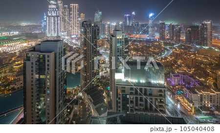 Aerial view of a big futuristic city day to night timelapse. Business bay and Downtown 105040408