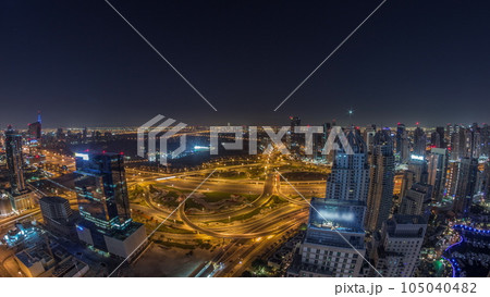 Huge highway crossroad junction between JLT district and Dubai Marina all night timelapse. Huge highway crossroad junction between JLT district and Dubai Marina all night timelapse. 105040482