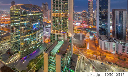 Dubai international financial center skyscrapers aerial day to night timelapse. Dubai international financial center skyscrapers aerial day to night timelapse. 105040513
