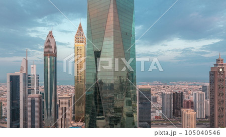 Financial center of Dubai city with luxury skyscrapers night to day timelapse, Dubai, United Arab Emirates Financial center of Dubai city with luxury skyscrapers night to day timelapse, Dubai, United Arab Emirates 105040546
