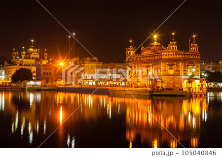 Sikh sacred site gurdwara Sri Harmandir Sahib also known as The Golden Temple also Darbar Sahib illuminated at night. Amritsar, Punjab state, India Sikh sacred site gurdwara Sri Harmandir Sahib also known as The Golden Temple also Darbar Sahib illuminated at night. Amritsar, Punjab state, India 105040846
