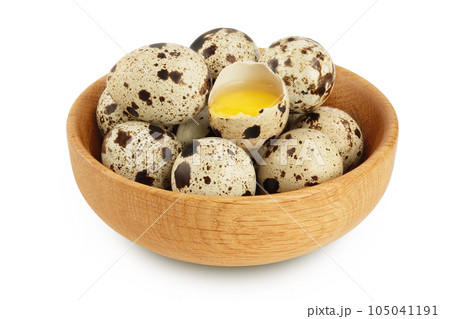 Raw quail egg in wooden bowl isolated on white background with full depth of field Raw quail egg in wooden bowl isolated on white background with full depth of field 105041191