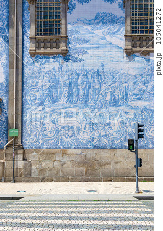 Azulejo tile in Porto, Portugal. Traditional portuguese ceramic decoration blue color. Historic building wall facade. Azulejo tile in Porto, Portugal. Traditional portuguese ceramic decoration blue color. Historic building wall facade. 105041272