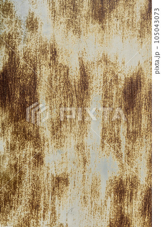 The background of an old iron sheet painted with rust spots The background of an old iron sheet painted with rust spots 105043073