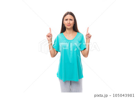 portrait of a pretty young caucasian brunette woman with long hair in a blue t-shirt showing with portrait of a pretty young caucasian brunette woman with long hair in a blue t-shirt showing with 105043981