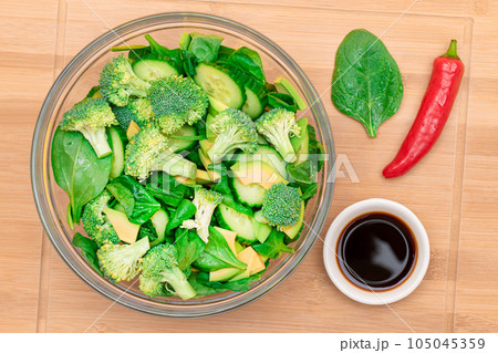 Fresh Green Salad of Avocado, Broccoli, Spinach and Cucumber 105045359