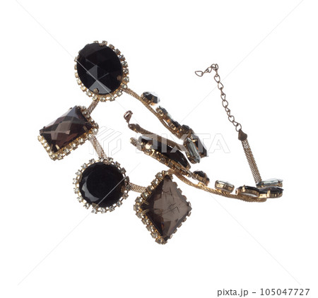Crystal jewel bead style necklet fly in air. Crystal Jewelry bead necklace as gemstone for fashion ornament decorative items. Fashion ornament necklace to add more style. White background isolated Crystal jewel bead style necklet fly in air. Crystal Jewelry bead necklace as gemstone for fashion ornament decorative items. Fashion ornament necklace to add more style. White background isolated 105047727