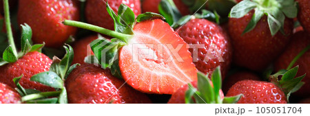 Whole and sliced fresh ripe strawberries as background. Whole and sliced fresh ripe strawberries as background. 105051704