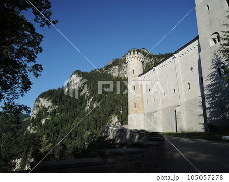 Neuschwanstein Castle is a 19th century historicist palace on a rugged hill above the village of Hohenschwangau near Fussen in southwest Bavaria, Germany. 105057278