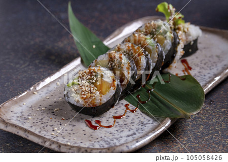 Delicious fresh sushi, raw fish, delicious Japanese food Delicious fresh sushi, raw fish, delicious Japanese food 105058426