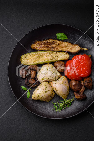 Delicious juicy grilled chicken with salt, spices and herbs with vegetables 105064703