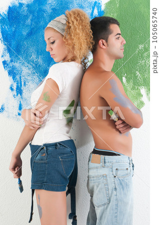Portrait of couple painting at home Portrait of couple painting at home 105065740