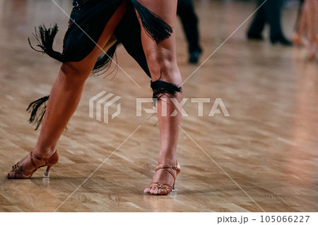 feet female dancer in brown dancing shoes, dancesport competition, pasodoble dance 105066227