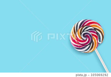Colorful lollipops on blue background Colorful lollipops on blue background 105069292