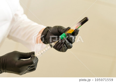 osmetologist holds test tube with blood osmetologist holds test tube with blood 105071559