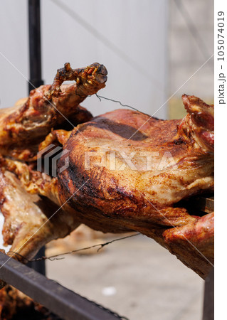 Barbeque. a whole carcass of sheep to roast on a spit. Food at the fair. 105074019