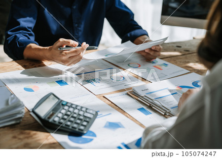 startup business, business team planning teamwork paperwork audit and discussing marketing, profit, budget of company in meeting room 105074247