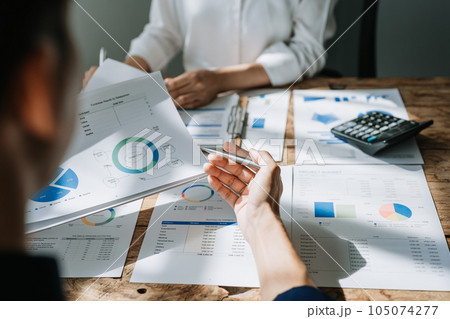 startup business, business team planning teamwork paperwork audit and discussing marketing, profit, budget of company in meeting room 105074277