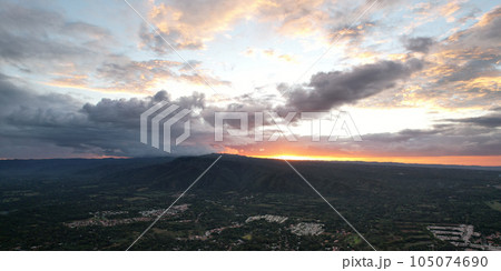 Beutiful sunset over green hills 105074690