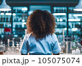 The back of black female scientist with curly hair, genertaiv AI. 105075074