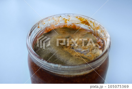 mold on raspberry jam, spoiled foods, mold jar, violation of cooking technology, health hazard, canned foods 105075369