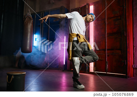 Cool Hip hop dancer in trendy street clothes dancing Cool Hip hop dancer in trendy street clothes dancing 105076869